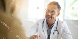 stock photo doctor with patient in medical office 718155163